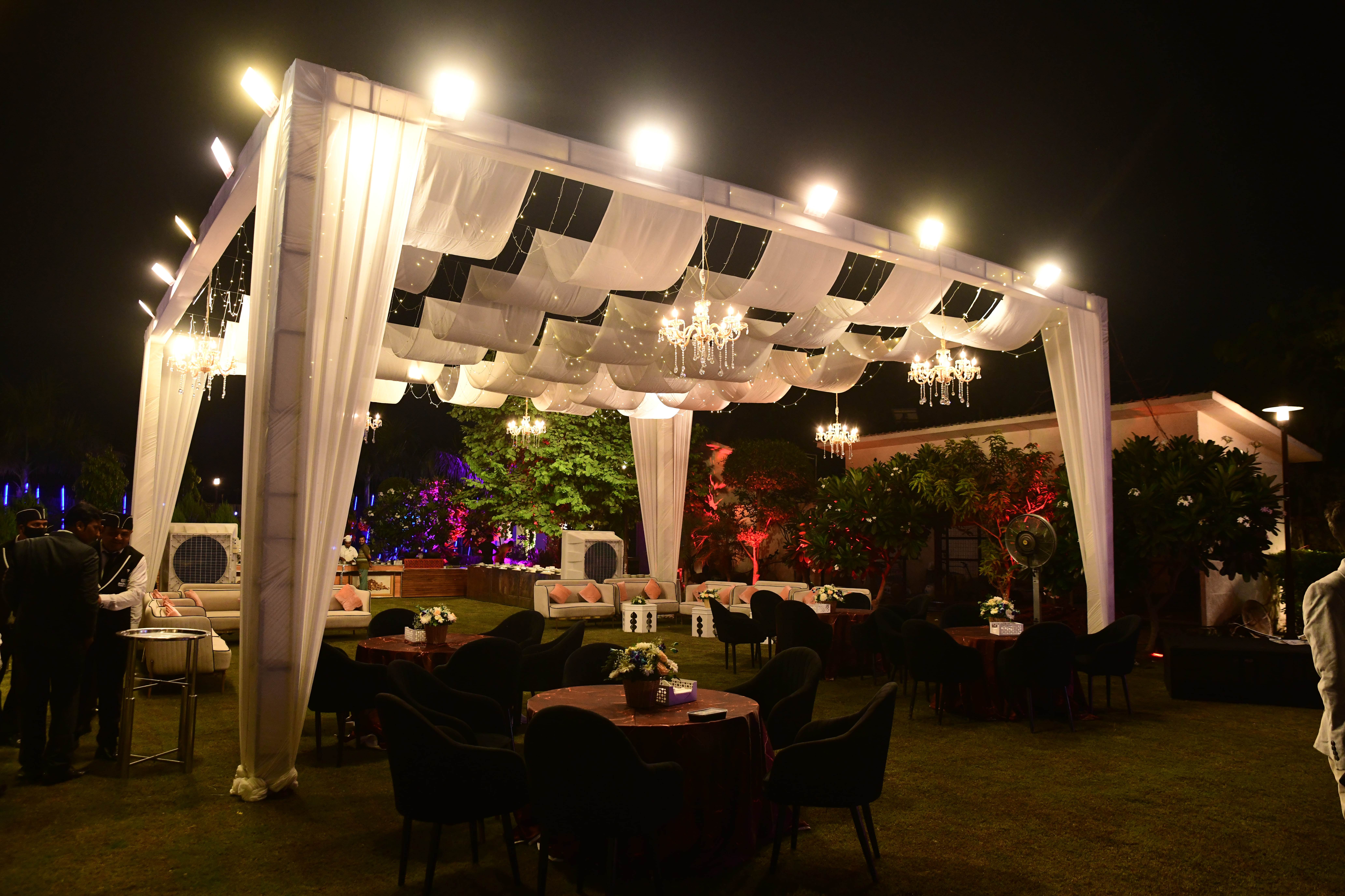 White tent with decorative lights in Greater Noida