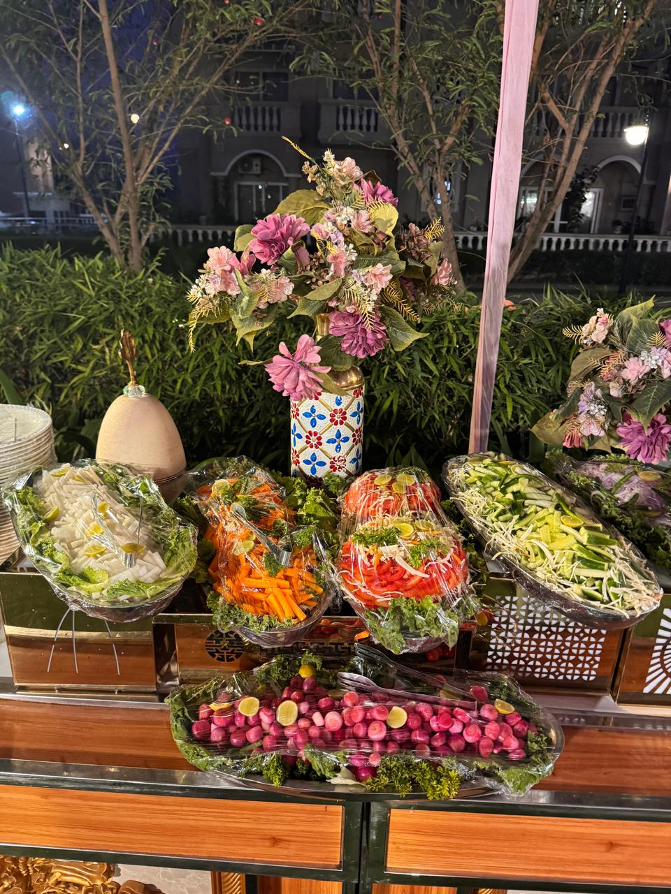 Fresh salad buffet with tiered display and floral styling in Greater Noida